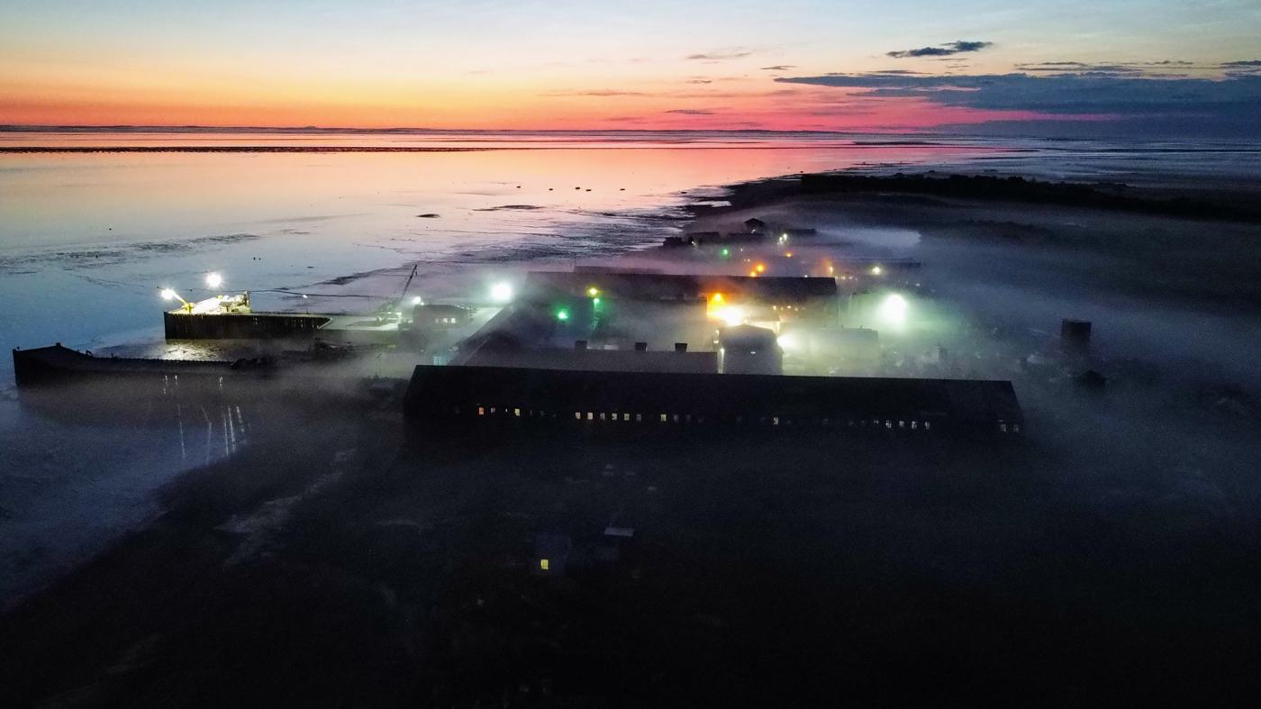 Naknek cannery in fog at sunset